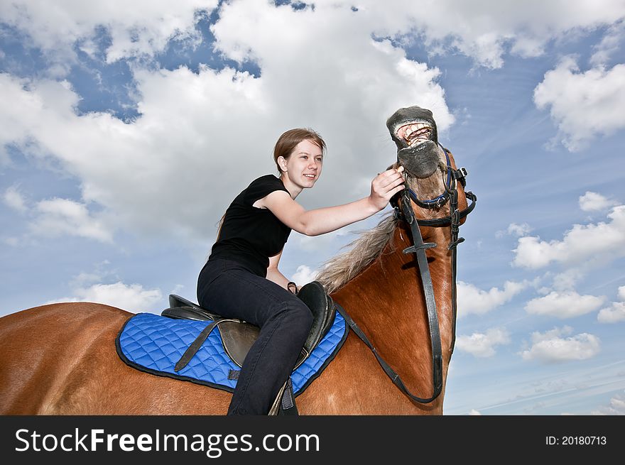 Nice Girl riding and feeding a Horse. Nice Girl riding and feeding a Horse