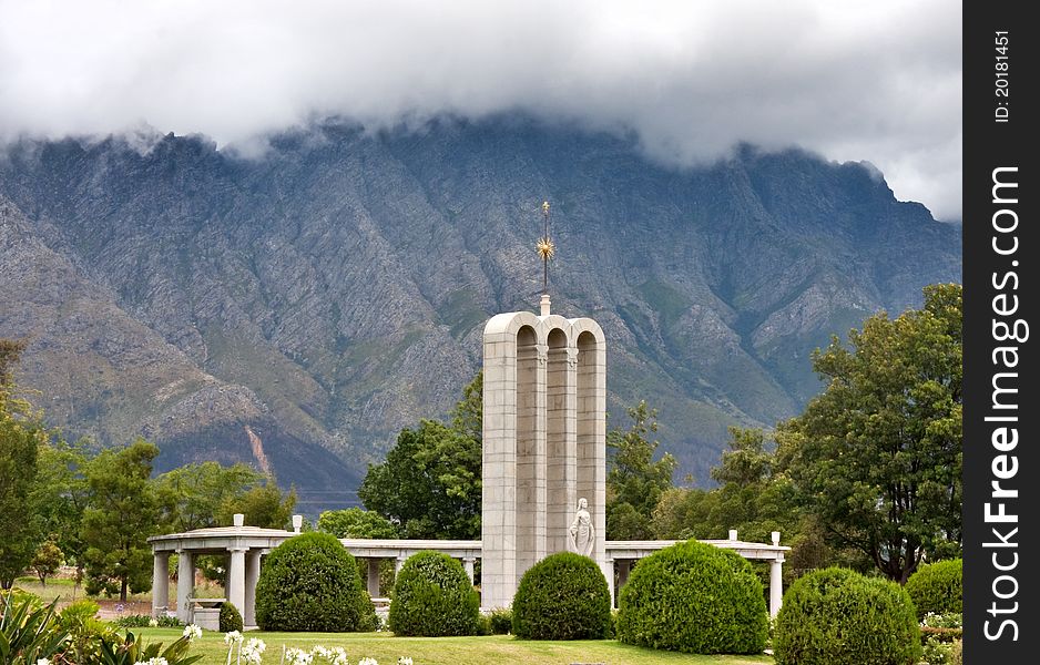 The Huguenot Monument in summer with green grass and blooming gardens in Franschhoek, Western Cape, South Africa. The Huguenot Monument in summer with green grass and blooming gardens in Franschhoek, Western Cape, South Africa