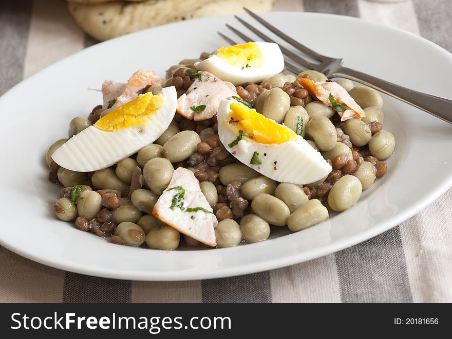 Grilled salmon, soya bean and boiled egg salad on a plate. Grilled salmon, soya bean and boiled egg salad on a plate