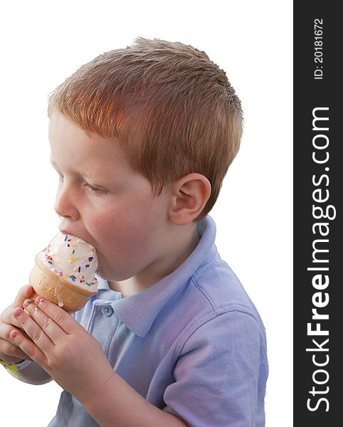 A young boy eating an ice cream cone.