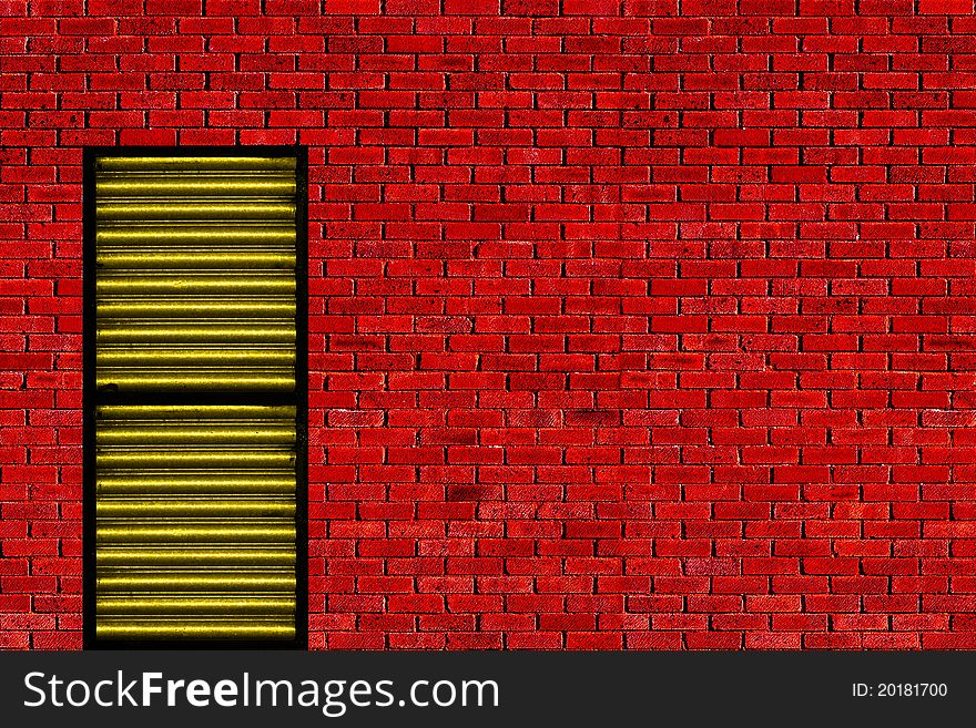 Yellow metal door in red brick wall. Yellow metal door in red brick wall