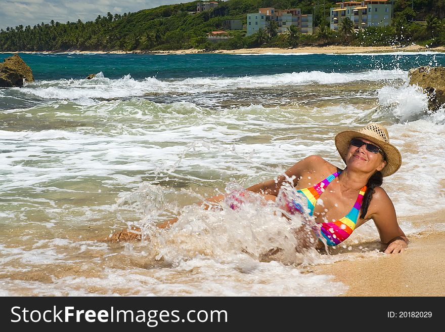 Woman lying on the beach