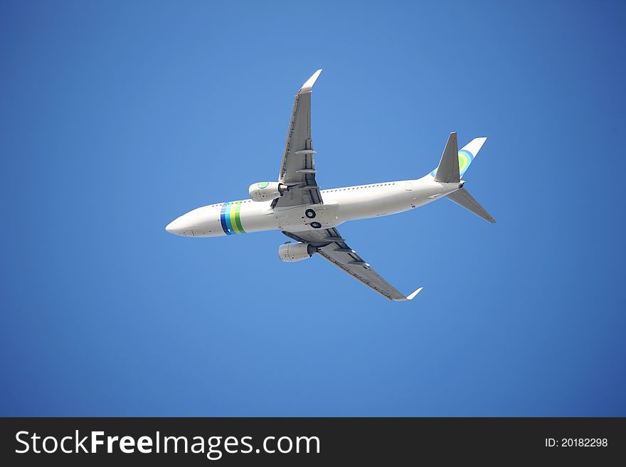 Airplane flying against a blue sky