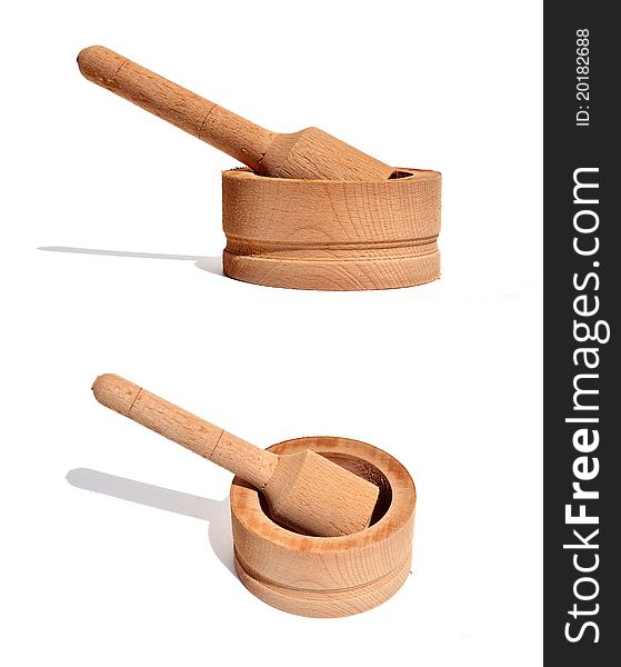 A newly made wooded pestle and mortar in two views. A newly made wooded pestle and mortar in two views