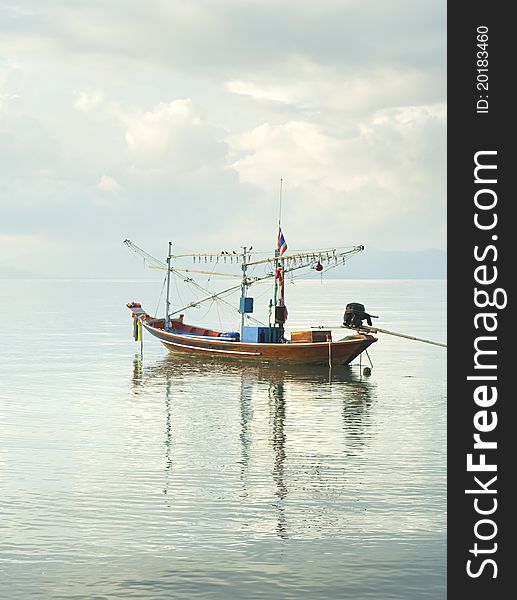 Traditional thailand boat  in the sea at sunrise