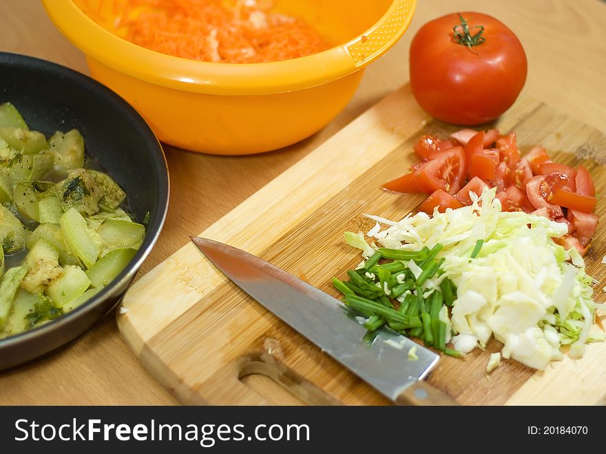 Sliced vegetables and kitchen knife