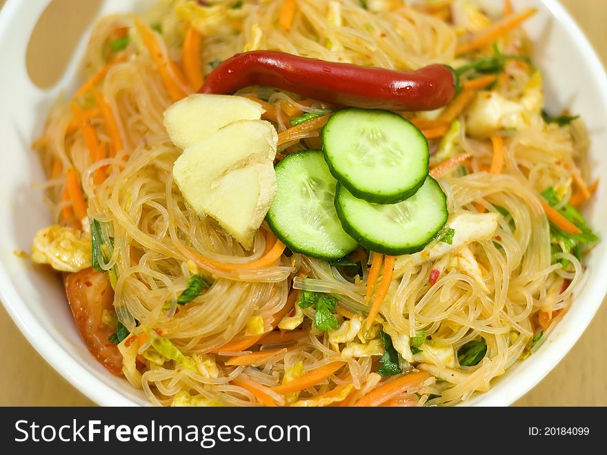 Salad of Korean noodle in the white bowl