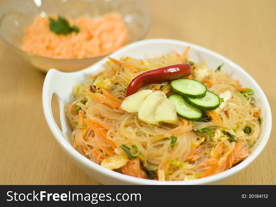 Salad of Korean noodle in the white bowl