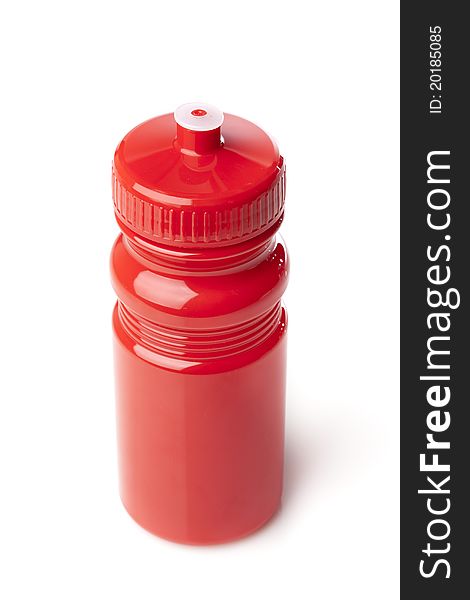 A red water bottle against a white background