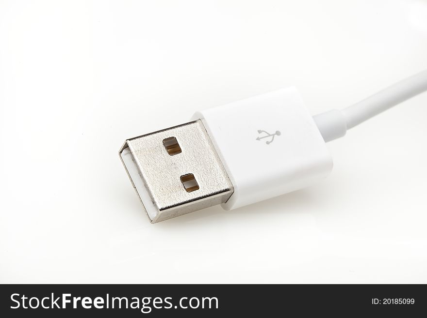 A white USB cable against a white background
