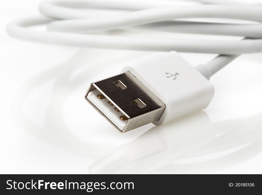 A white USB cable against a white background