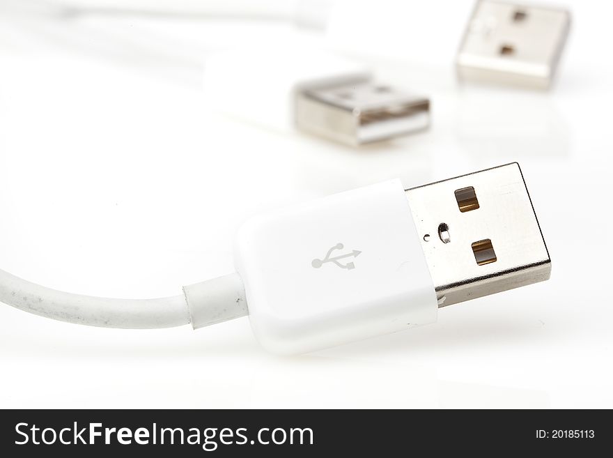 A white USB cable against a white background