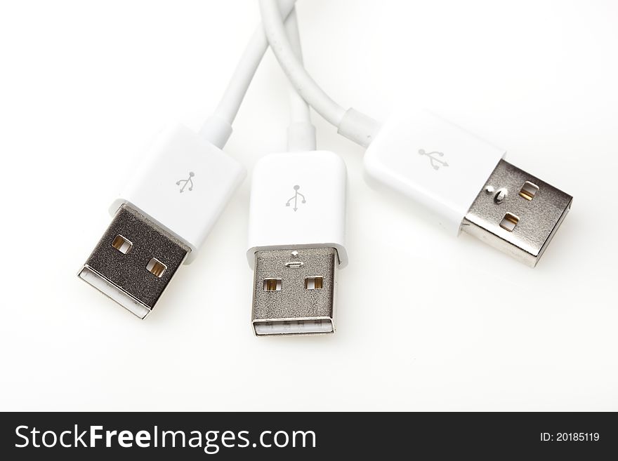 A white USB cable against a white background