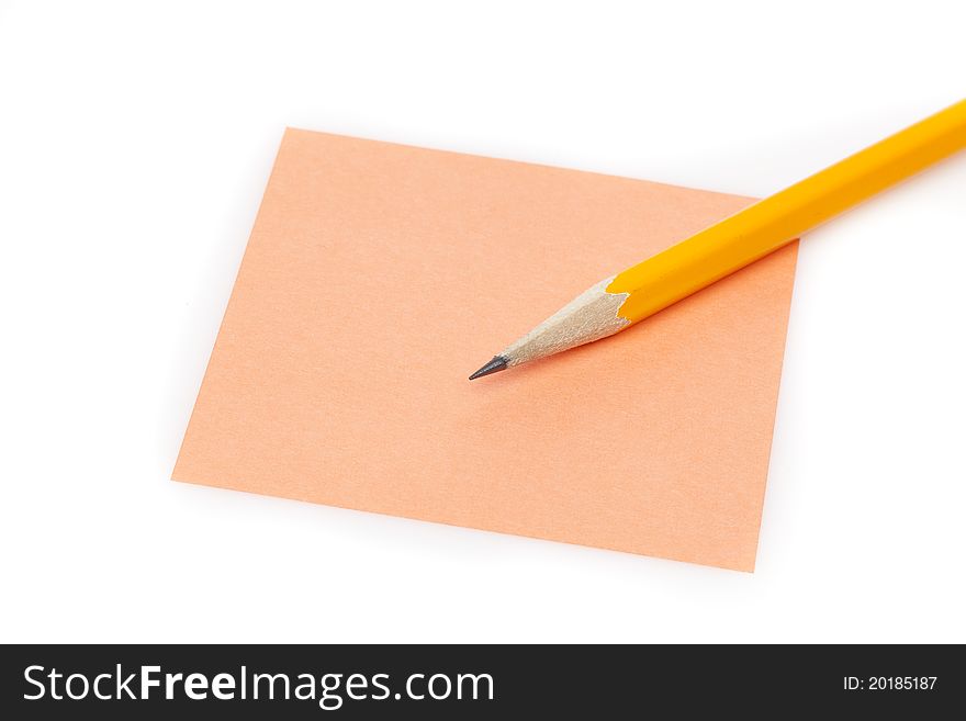 A colorful note pad with a pencil against a white background