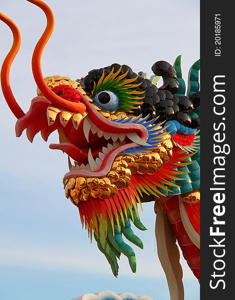 Chinese style dragon statue on white blue sky. Chinese style dragon statue on white blue sky