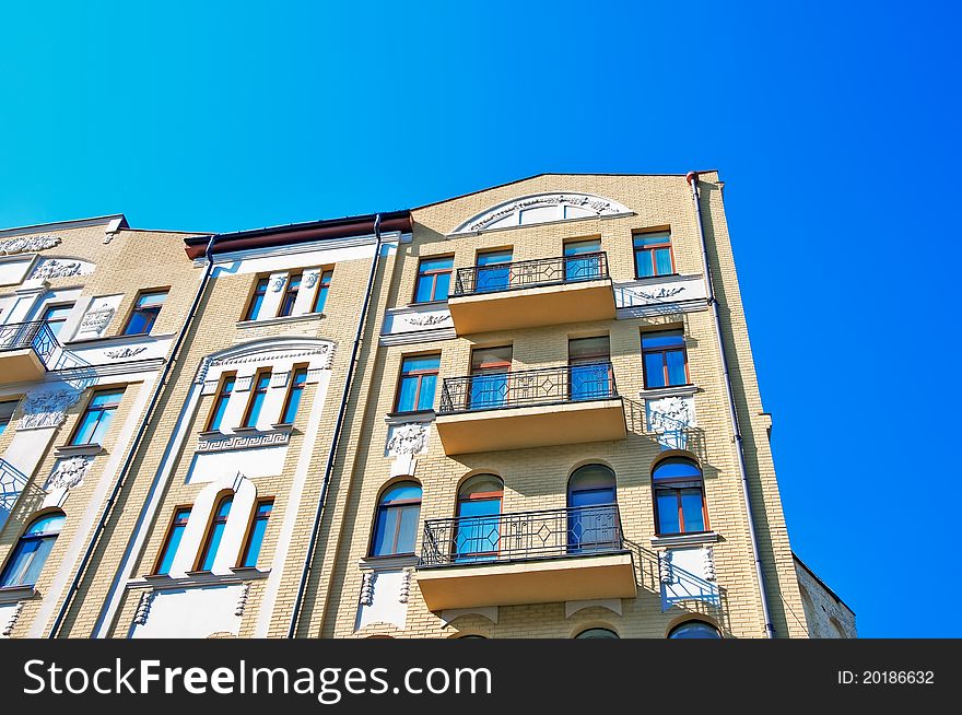 Vintage yellow building over clean blue sky in a daylight. Vintage yellow building over clean blue sky in a daylight