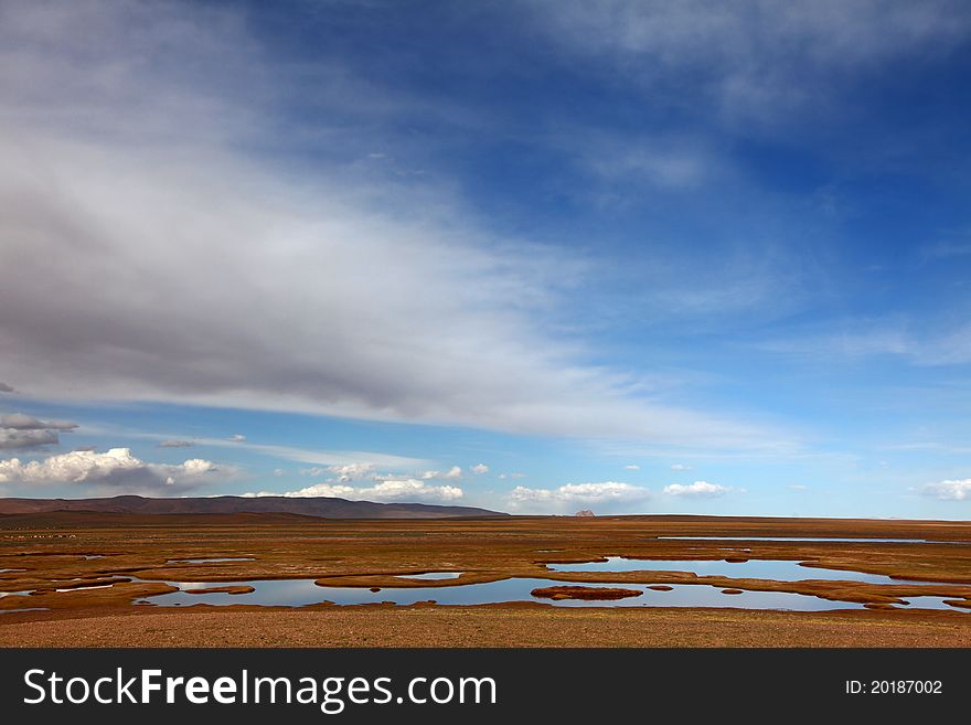 Couldscape over beautiful wetland in Tibet. Couldscape over beautiful wetland in Tibet
