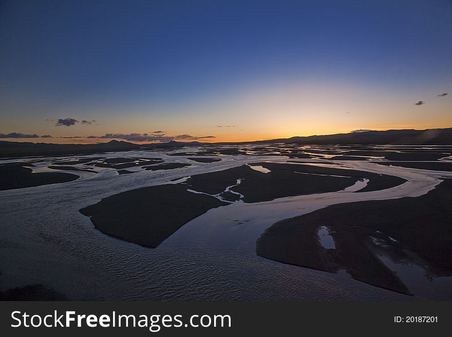 Sunset over Tuotuo River, the headstream of Yangtze River. Sunset over Tuotuo River, the headstream of Yangtze River