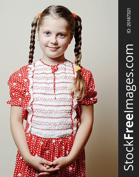 An image of a beautiful little girl in a dress. An image of a beautiful little girl in a dress