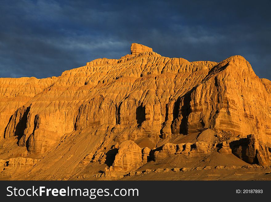 Fortress-like weathering mountian at sunset. Fortress-like weathering mountian at sunset