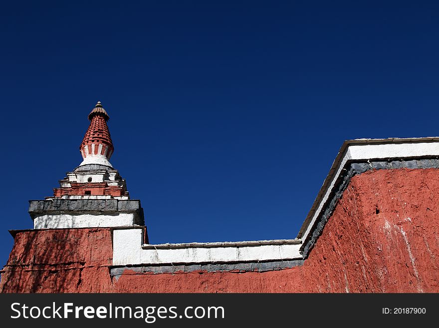 Old buddhistic stupa against blue sky