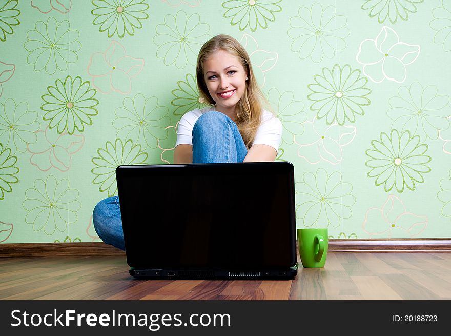 Young woman on the floor working with laptop. Young woman on the floor working with laptop