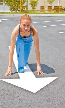 Athletic Woman In Start Position On Track Stock Image