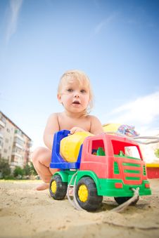 Adorable Baby Play With Toy Concrete Mixer Truck Royalty Free Stock Photography Adorable Baby Play With Toy Concrete Mixer Truck Royalty Free Stock Photography