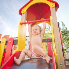 Young Adorable Baby Sliding Down Baby Slide Stock Photos Young Adorable Baby Sliding Down Baby Slide Stock Photos