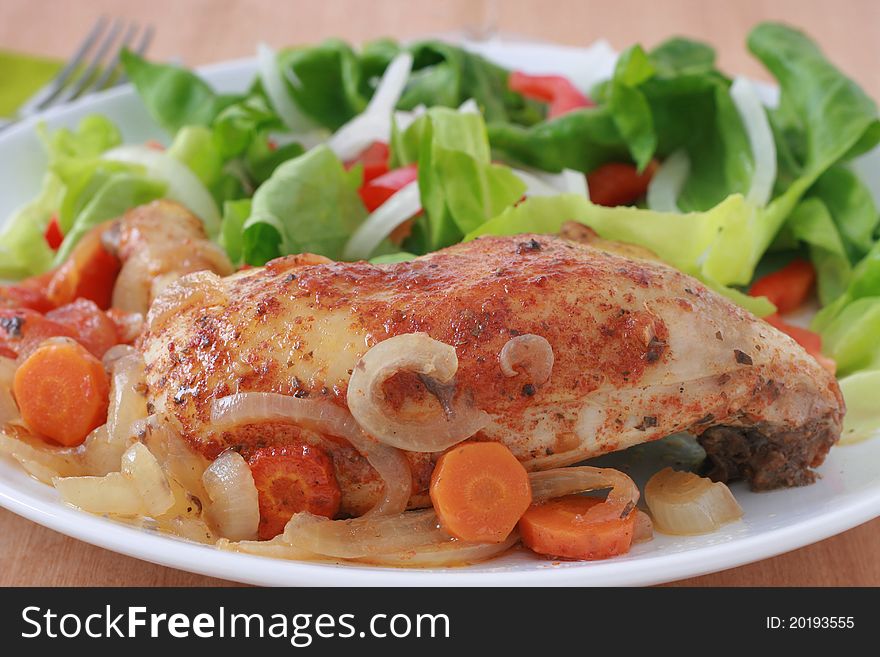 Fried chicken with onion and carrot and salad. Fried chicken with onion and carrot and salad