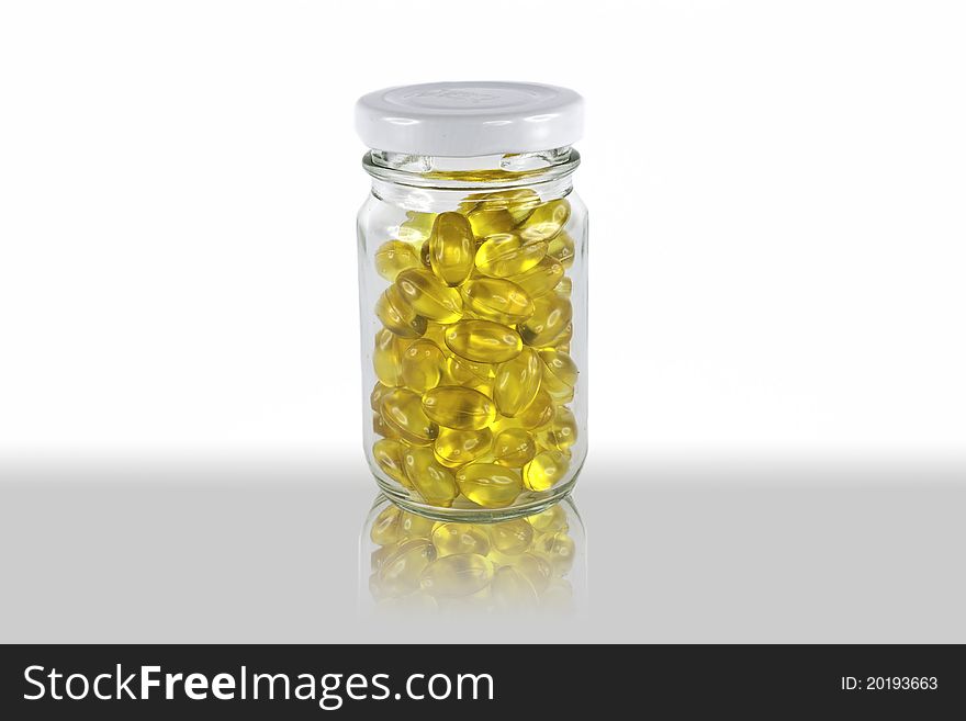Fish oil in glass bottle with white background