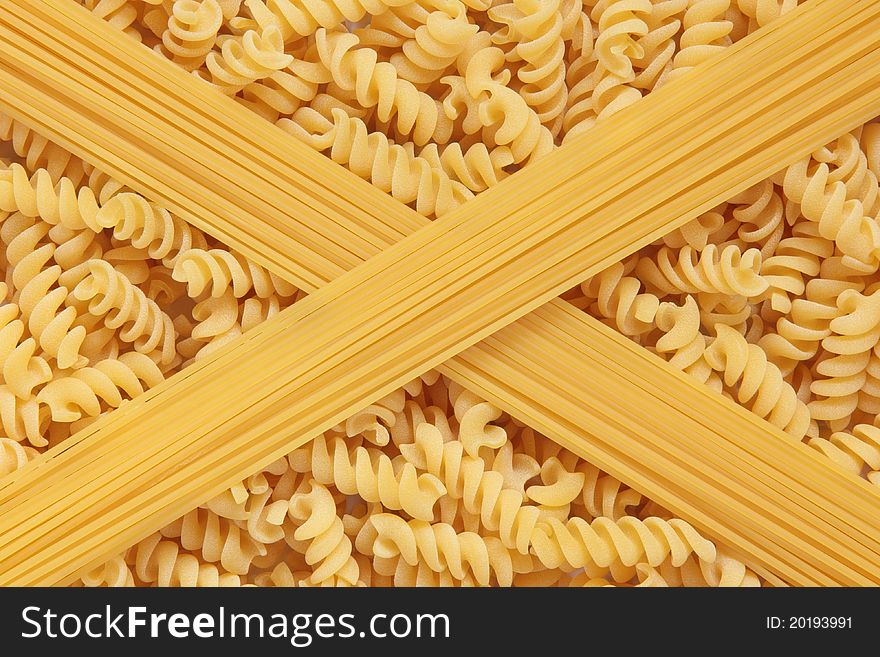 Fusilli and spaghetti pasta in abstract design. Fusilli and spaghetti pasta in abstract design.