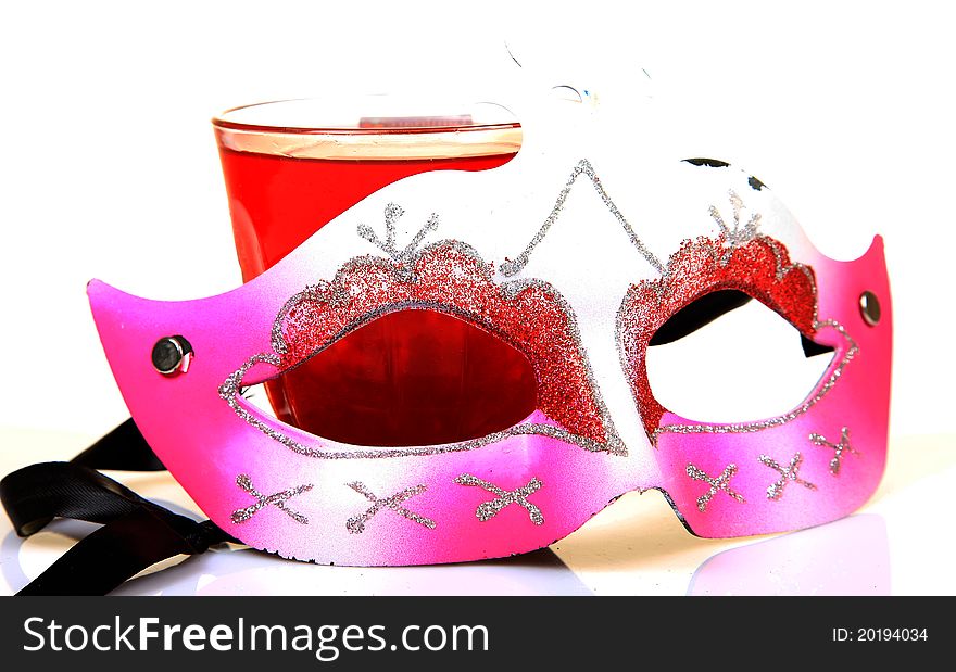 Party mask with drink over white background. Party mask with drink over white background.