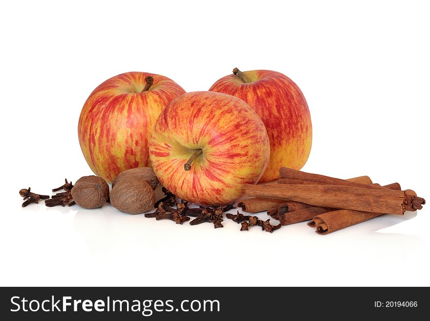 Apple gala fruit variety with clove, cinnamon and nutmeg spice isolated over white background. Apple gala fruit variety with clove, cinnamon and nutmeg spice isolated over white background.