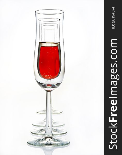 Glasses with red champagne and empty glasses