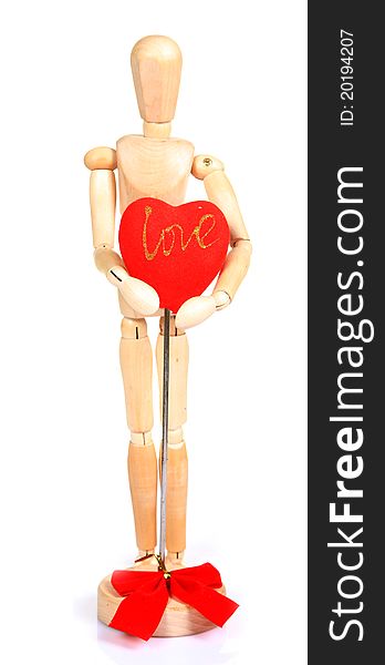 Wooden mannequin holding red heart over white background. Wooden mannequin holding red heart over white background.