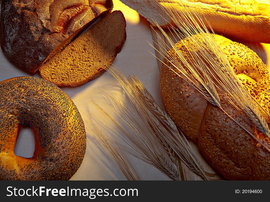 Bread on a table under light of the morning sun. Bread on a table under light of the morning sun