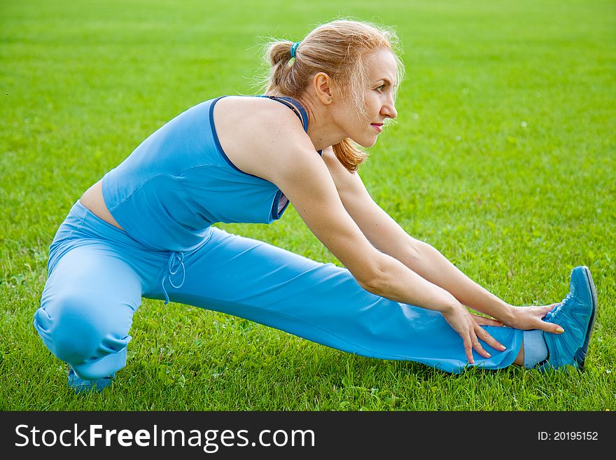 Attractive a Woman stretching before Fitness and Exercise