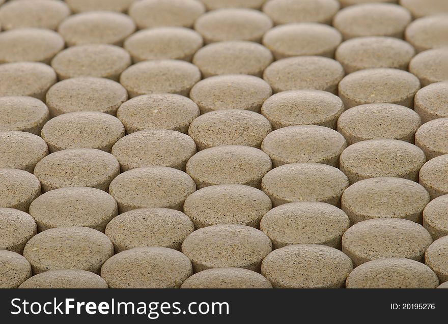 Closeup background of brown pills