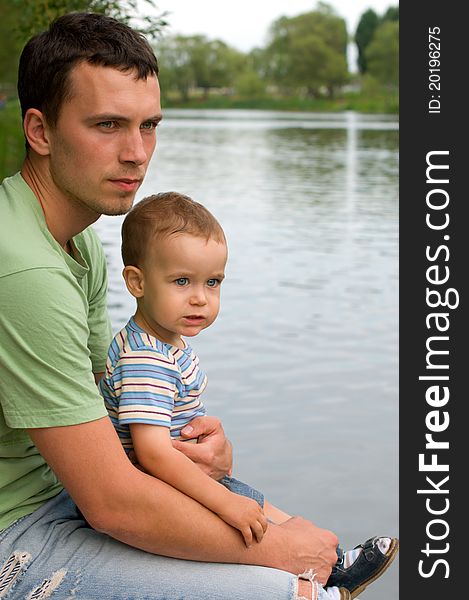 Portrait of father and son near the river. Portrait of father and son near the river