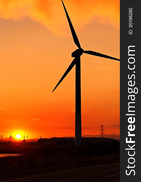 Wind turbine over beautiful sunset. Wind turbine over beautiful sunset