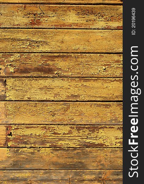 Old shabby painted yellow wooden planks texture. Old shabby painted yellow wooden planks texture