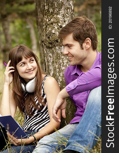 Two Students At Outdoor Doing Homework