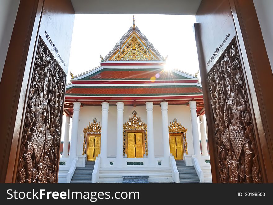 Carved wooden door open to Magut temple, Bangkok Thailand. Carved wooden door open to Magut temple, Bangkok Thailand