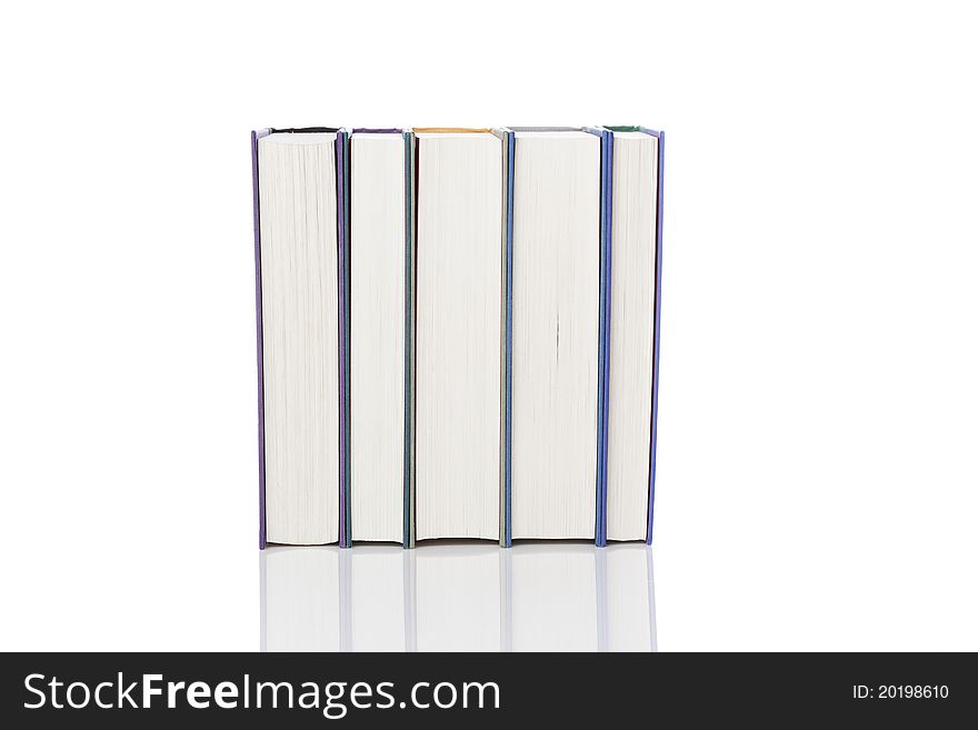 A group of books against a white background