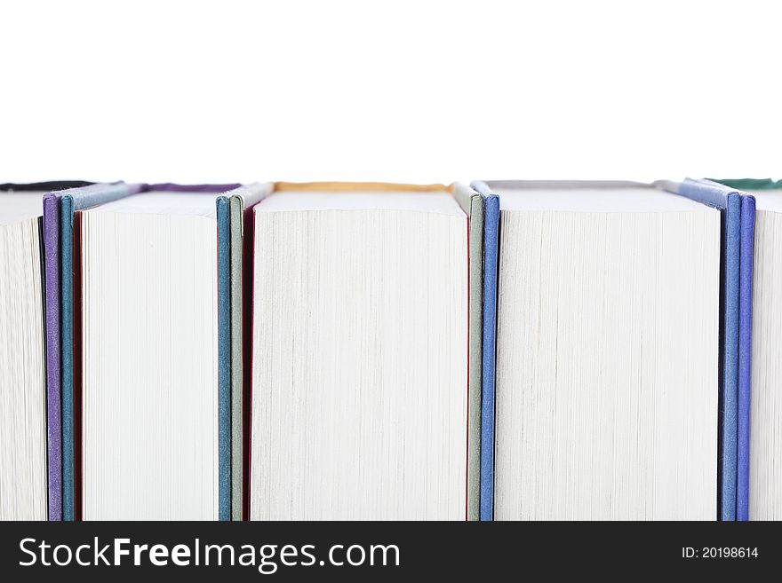 A group of books against a white background
