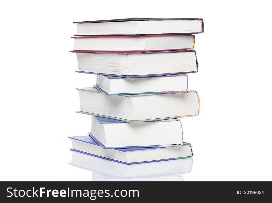 A group of books against a white background