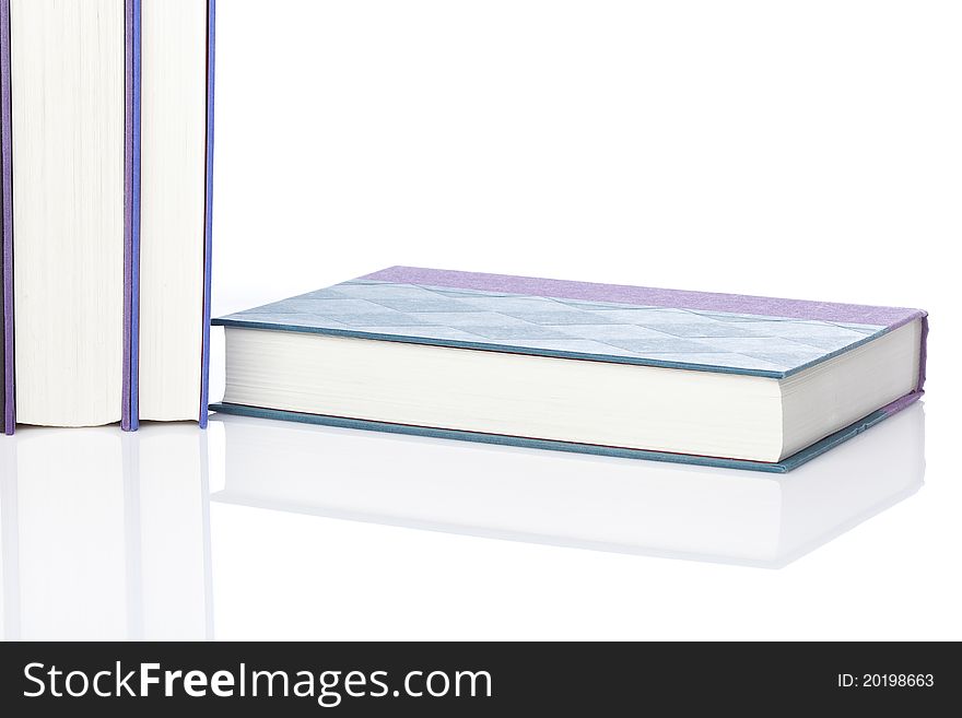 A group of books against a white background