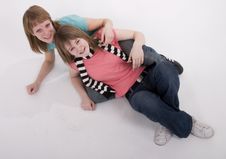 Two Girls On The Floor Stock Photo Two Girls On The Floor Stock Photo