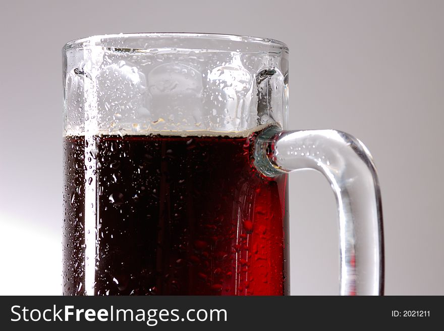 Glass of dark beer close-up